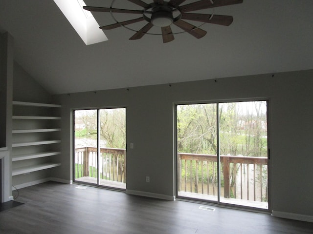 unfurnished living room featuring baseboards, a ceiling fan, visible vents, and wood finished floors