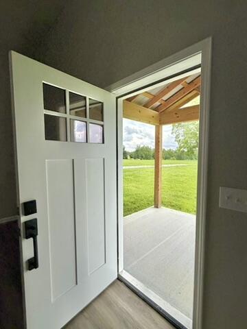 1476 Gosser Ridge Rd, Liberty, KY 42539 - doorway with light wood finished floors and vaulted ceiling