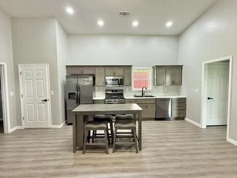 1476 Gosser Ridge Rd, Liberty, KY 42539 - kitchen with appliances with stainless steel finishes, light wood-type flooring, light countertops, recessed lighting, and a towering ceiling