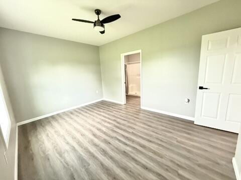 1476 Gosser Ridge Rd, Liberty, KY 42539 - unfurnished bedroom with wood finished floors and ceiling fan