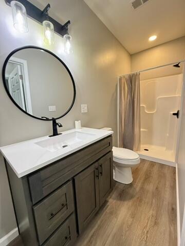 1476 Gosser Ridge Rd, Liberty, KY 42539 - bathroom featuring curtained shower, wood finished floors, and vanity