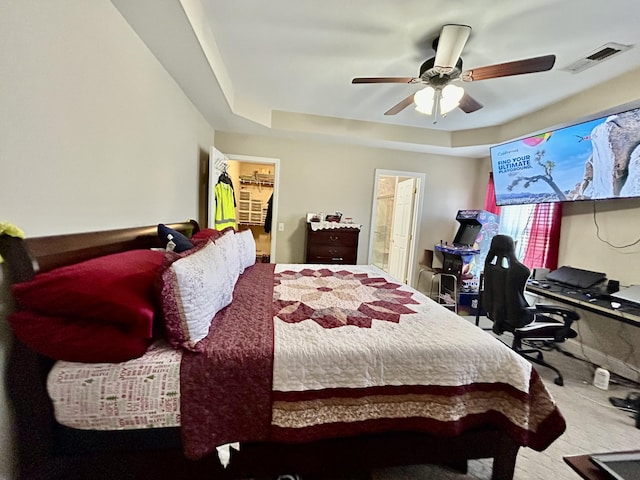 199 Newport Ln, Berea, KY 40403 - bedroom featuring carpet floors, a walk in closet, a raised ceiling, a ceiling fan, and ensuite bath