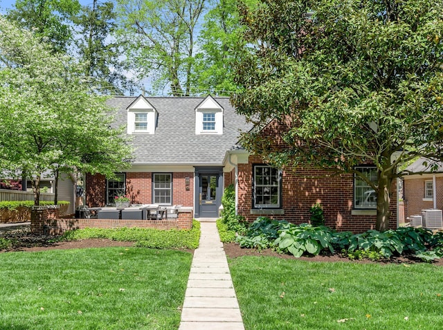 211 Chenault Rd, Lexington, KY 40502 - new england style home featuring roof with shingles, brick siding, and central air condition unit