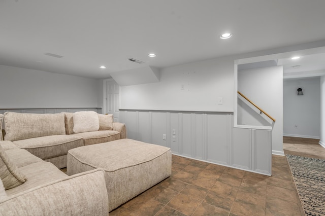 211 Chenault Rd, Lexington, KY 40502 - living area with recessed lighting, dark stone finish flooring, a wainscoted wall, and a decorative wall