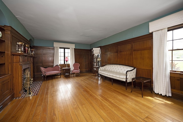 living area featuring hardwood / wood-style floors and a fireplace