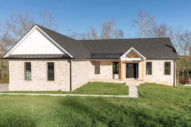 437 Boones Creek Rd, Lancaster, KY 40444 - modern inspired farmhouse featuring a standing seam roof, metal roof, brick siding, and a front lawn