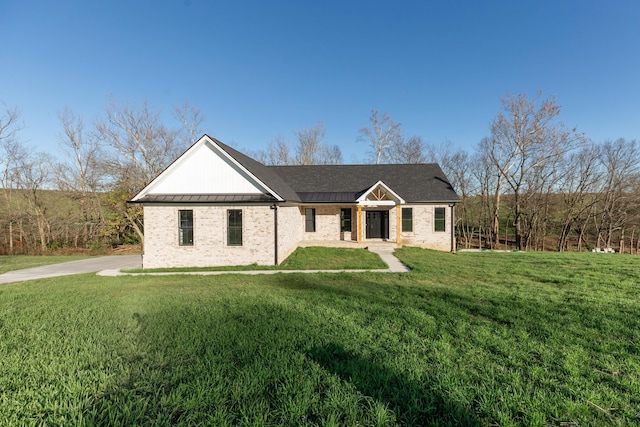 437 Boones Creek Rd, Lancaster, KY 40444 - view of front of property featuring a front yard, brick siding, metal roof, and a standing seam roof