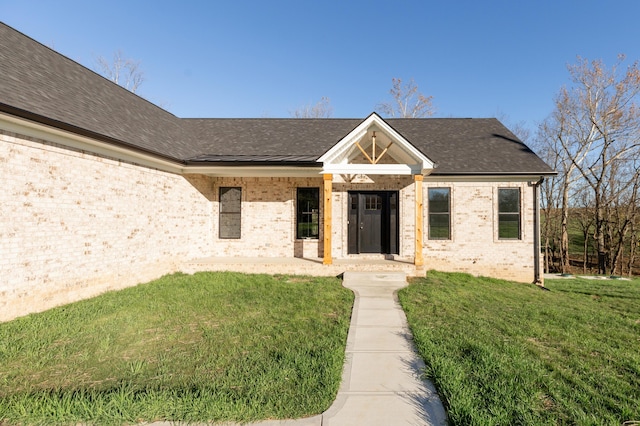 437 Boones Creek Rd, Lancaster, KY 40444 - view of front of property featuring a shingled roof, a front lawn, and brick siding