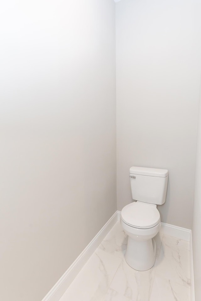 437 Boones Creek Rd, Lancaster, KY 40444 - bathroom with toilet, marble finish floor, and baseboards