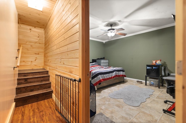 88 Hawkins Ln, Clay City, KY 40312 - bedroom with ornamental molding, baseboards, a ceiling fan, and wood walls