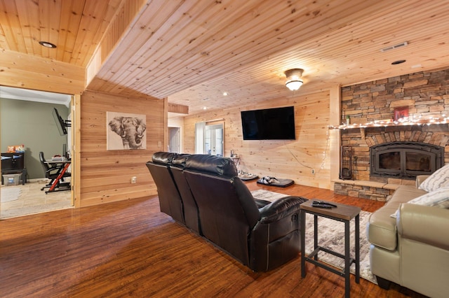 88 Hawkins Ln, Clay City, KY 40312 - living room with wood ceiling, wood finished floors, wood walls, and a stone fireplace