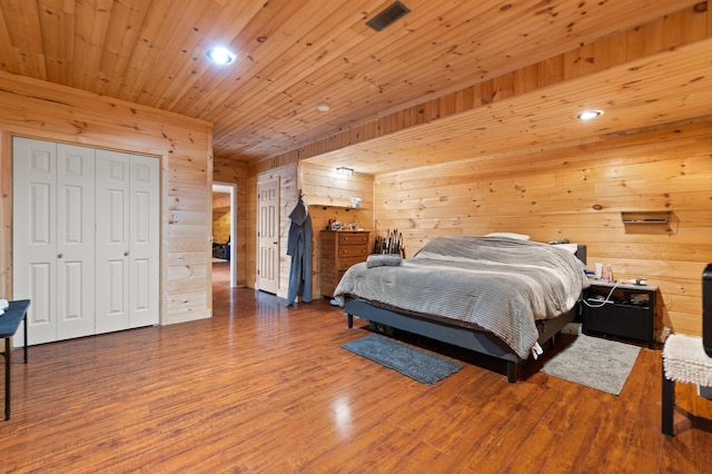 88 Hawkins Ln, Clay City, KY 40312 - bedroom featuring wood finished floors, wood walls, visible vents, and recessed lighting