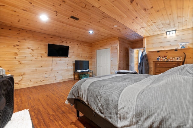 88 Hawkins Ln, Clay City, KY 40312 - bedroom with wood finished floors, wooden walls, visible vents, and recessed lighting