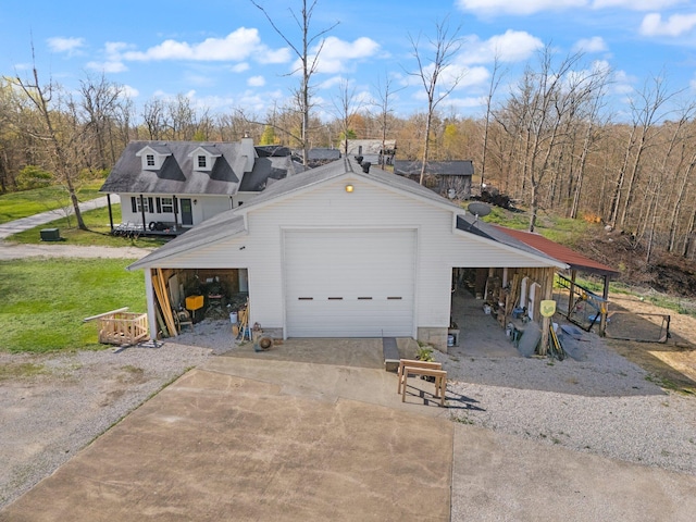 88 Hawkins Ln, Clay City, KY 40312 - garage with concrete driveway and a detached garage