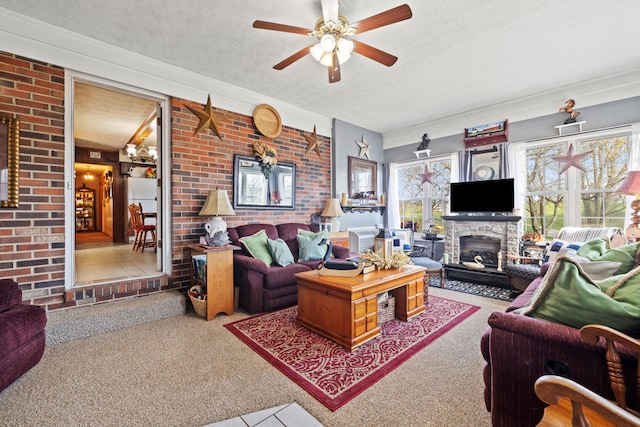 5245 US-68 W, Gravel Switch, KY 40328 - living area with a textured ceiling, a glass covered fireplace, a ceiling fan, carpet, and brick wall