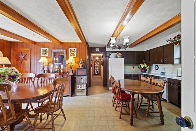 5245 US-68 W, Gravel Switch, KY 40328 - dining room featuring beam ceiling, light flooring, a chandelier, a textured ceiling, and wooden walls