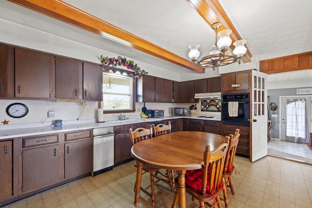 5245 US-68 W, Gravel Switch, KY 40328 - kitchen with oven, light flooring, under cabinet range hood, a chandelier, and a sink