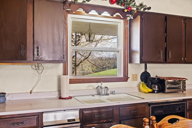 5245 US-68 W, Gravel Switch, KY 40328 - kitchen featuring black dishwasher, a sink, light countertops, and dark brown cabinets