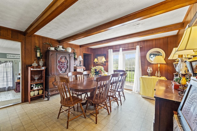 5245 US-68 W, Gravel Switch, KY 40328 - dining room featuring beamed ceiling, wooden walls, a textured ceiling, and light floors