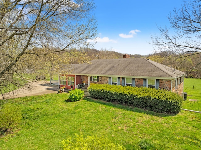 5245 US-68 W, Gravel Switch, KY 40328 - ranch-style home featuring brick siding, a front yard, a patio area, a chimney, and cooling unit
