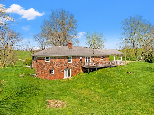 5245 US-68 W, Gravel Switch, KY 40328 - rear view of house featuring a chimney, brick siding, a wooden deck, a lawn, and cooling unit