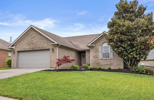 ranch-style house with a garage, brick siding, concrete driveway, a front yard, and roof with shingles