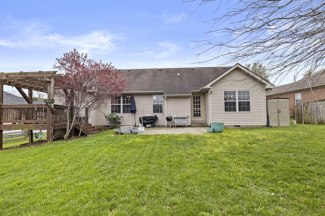 rear view of property with a patio area, a pergola, crawl space, a shed, and a deck