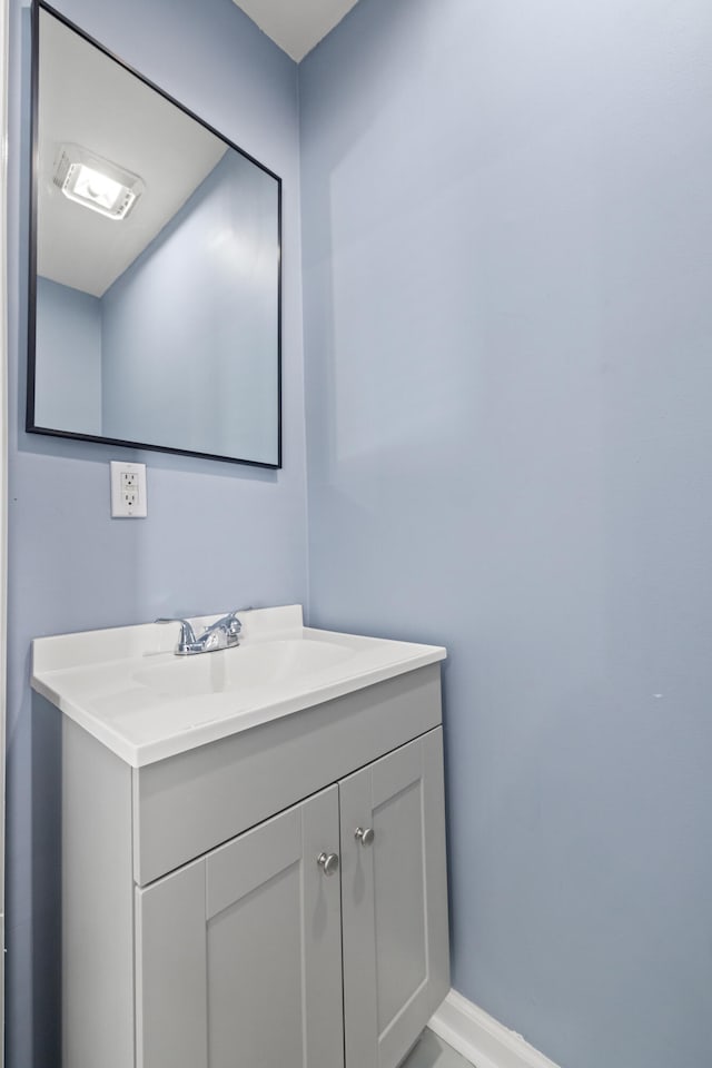 bathroom with baseboards and vanity