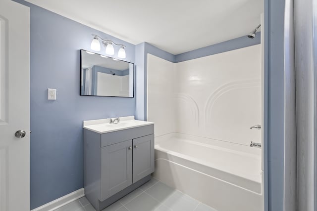 full bathroom with tile patterned flooring, vanity, bathtub / shower combination, and baseboards
