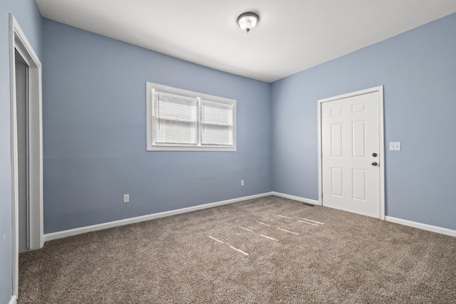 unfurnished bedroom featuring baseboards and carpet floors