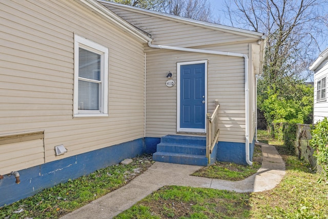 doorway to property featuring fence