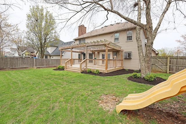 rear view of house with a yard, a pergola, a fenced backyard, and a chimney
