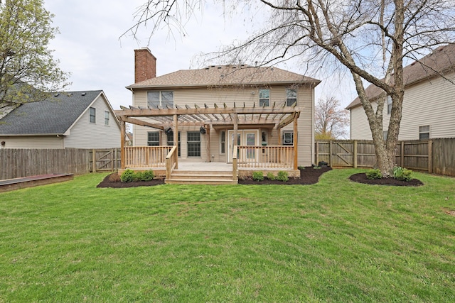 back of house featuring a pergola, a deck, a fenced backyard, and a chimney