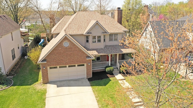 view of front of property featuring a shingled roof, a porch, concrete driveway, brick siding, and a front lawn