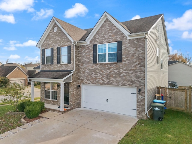 100 Barry Rd, Georgetown, KY 40324 - view of front of home featuring an attached garage, driveway, fence, and brick siding