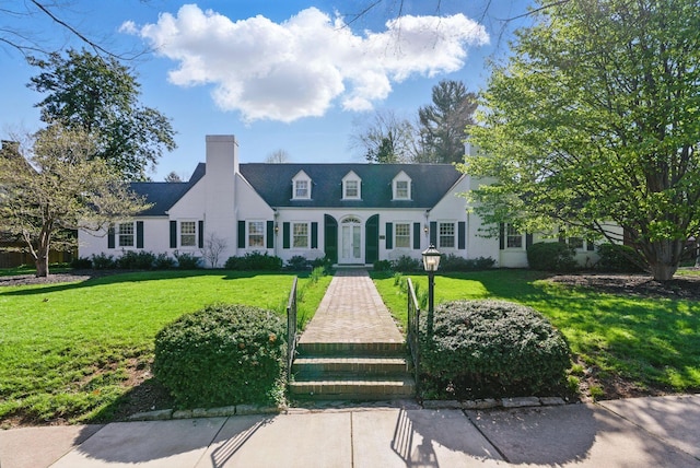 216 Ridgeway Rd, Lexington, KY 40502 - new england style home with french doors, a front lawn, and a chimney