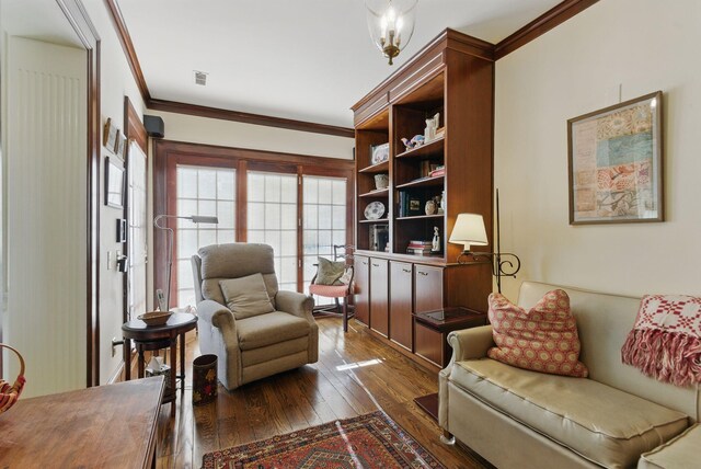 216 Ridgeway Rd, Lexington, KY 40502 - living area with crown molding, visible vents, and dark wood-style floors