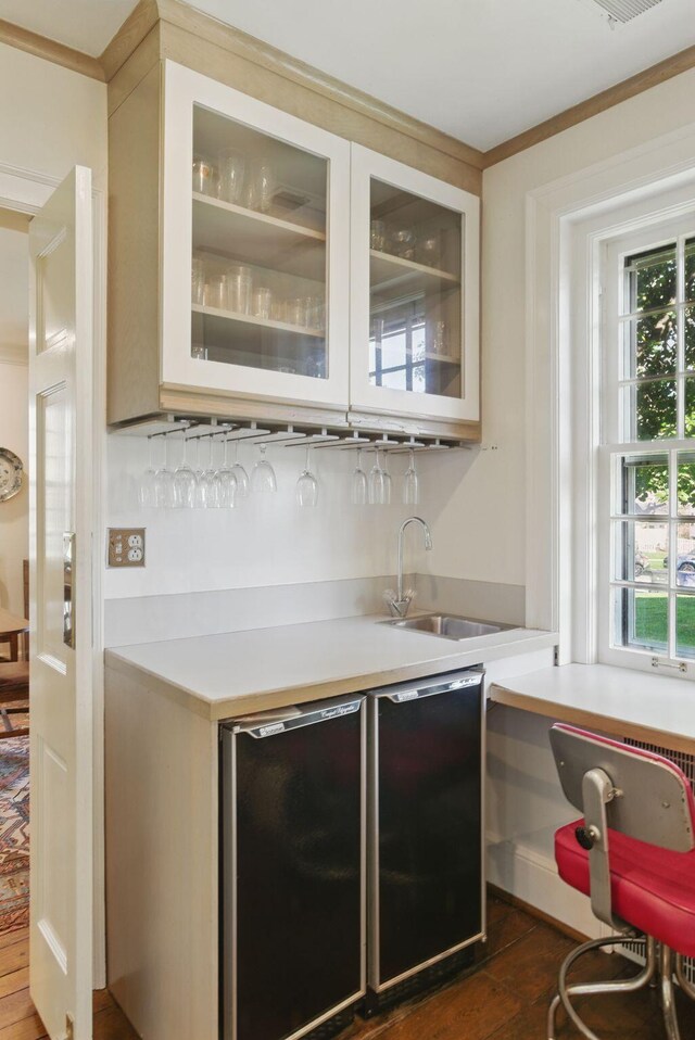 216 Ridgeway Rd, Lexington, KY 40502 - bar with indoor wet bar, a sink, ornamental molding, dark wood finished floors, and refrigerator