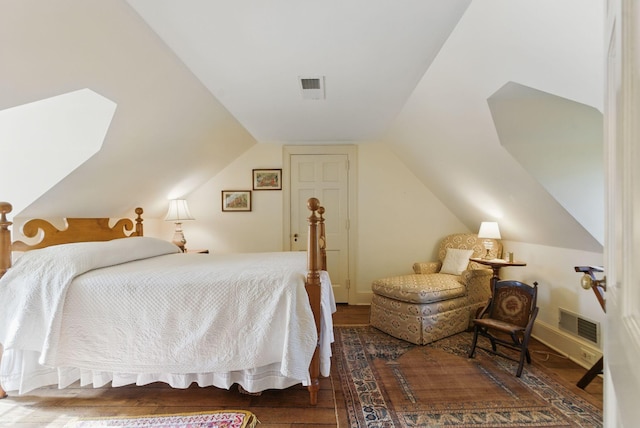 216 Ridgeway Rd, Lexington, KY 40502 - bedroom featuring visible vents, baseboards, wood finished floors, and lofted ceiling