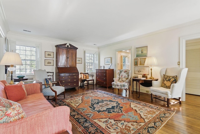 216 Ridgeway Rd, Lexington, KY 40502 - living area featuring crown molding, visible vents, and hardwood / wood-style flooring