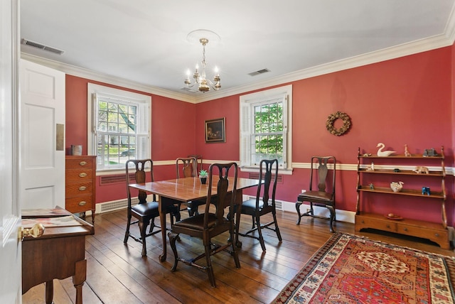 216 Ridgeway Rd, Lexington, KY 40502 - dining area with ornamental molding, visible vents, hardwood / wood-style floors, and a notable chandelier