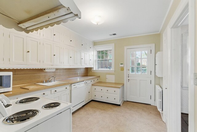 216 Ridgeway Rd, Lexington, KY 40502 - kitchen with white appliances, white cabinetry, visible vents, a sink, and light countertops