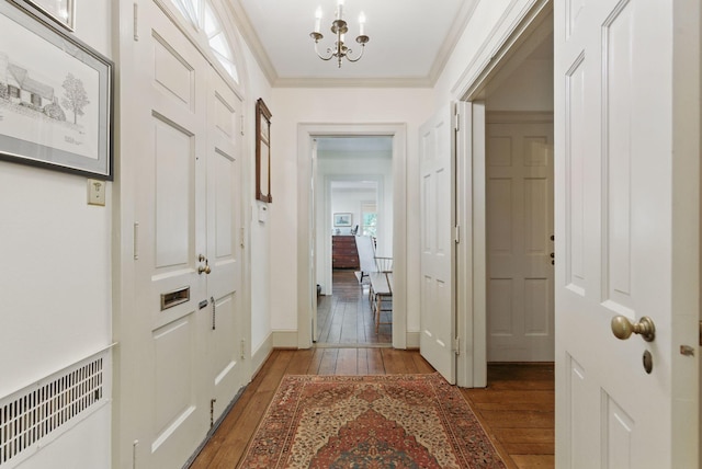 216 Ridgeway Rd, Lexington, KY 40502 - interior space featuring visible vents, baseboards, an inviting chandelier, ornamental molding, and light wood finished floors