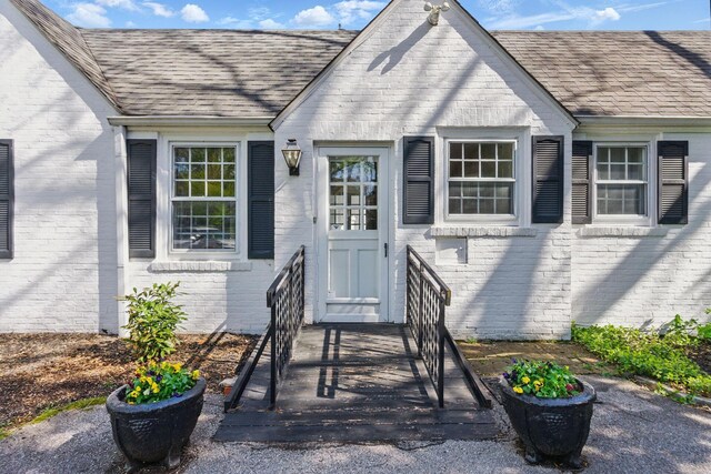 216 Ridgeway Rd, Lexington, KY 40502 - entrance to property with roof with shingles and brick siding