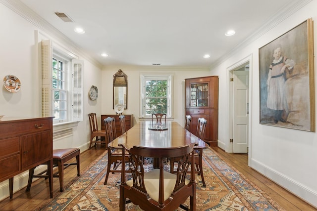 216 Ridgeway Rd, Lexington, KY 40502 - dining area with baseboards, wood-type flooring, ornamental molding, and visible vents