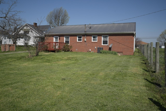 186 Main St, Sharpsburg, KY 40374 - back of house with brick siding, a yard, and fence