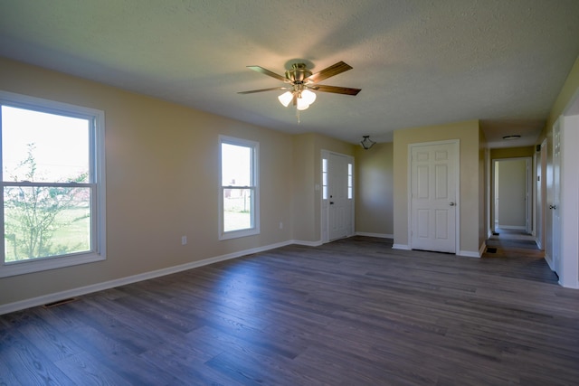 186 Main St, Sharpsburg, KY 40374 - unfurnished room with a ceiling fan, a textured ceiling, dark wood finished floors, baseboards, and visible vents