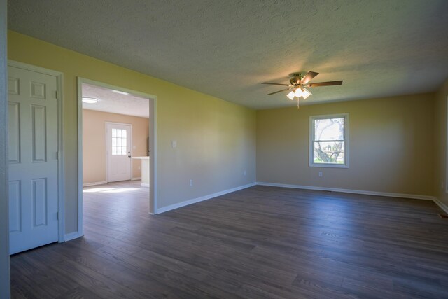 186 Main St, Sharpsburg, KY 40374 - unfurnished room featuring baseboards, a textured ceiling, ceiling fan, and dark wood finished floors
