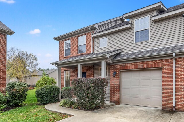 3693 Lochdale Ter, Lexington, KY 40514 - townhome / multi-family property with an attached garage, driveway, and brick siding