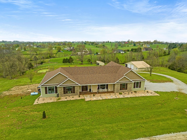 view of front of property featuring a front lawn and a porch